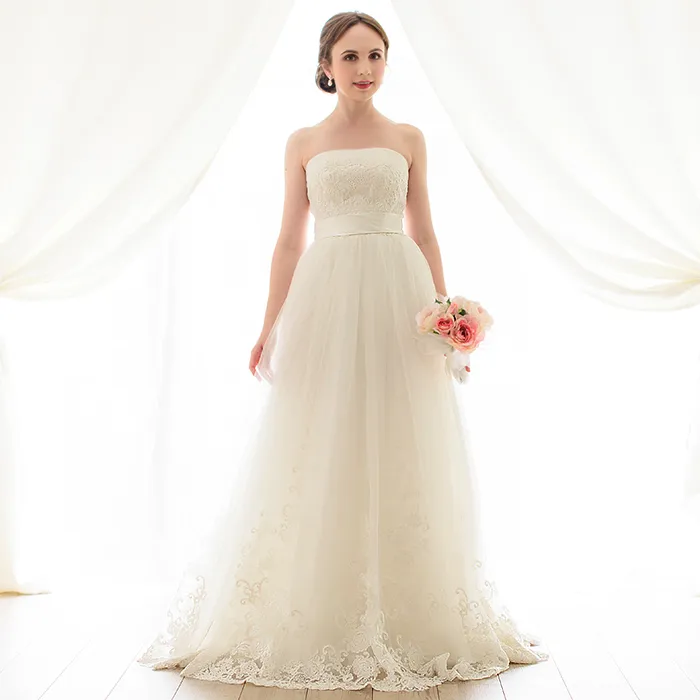 ---Empire wedding dress 2021 in tulle and lace with a straight neckline and satin belt--